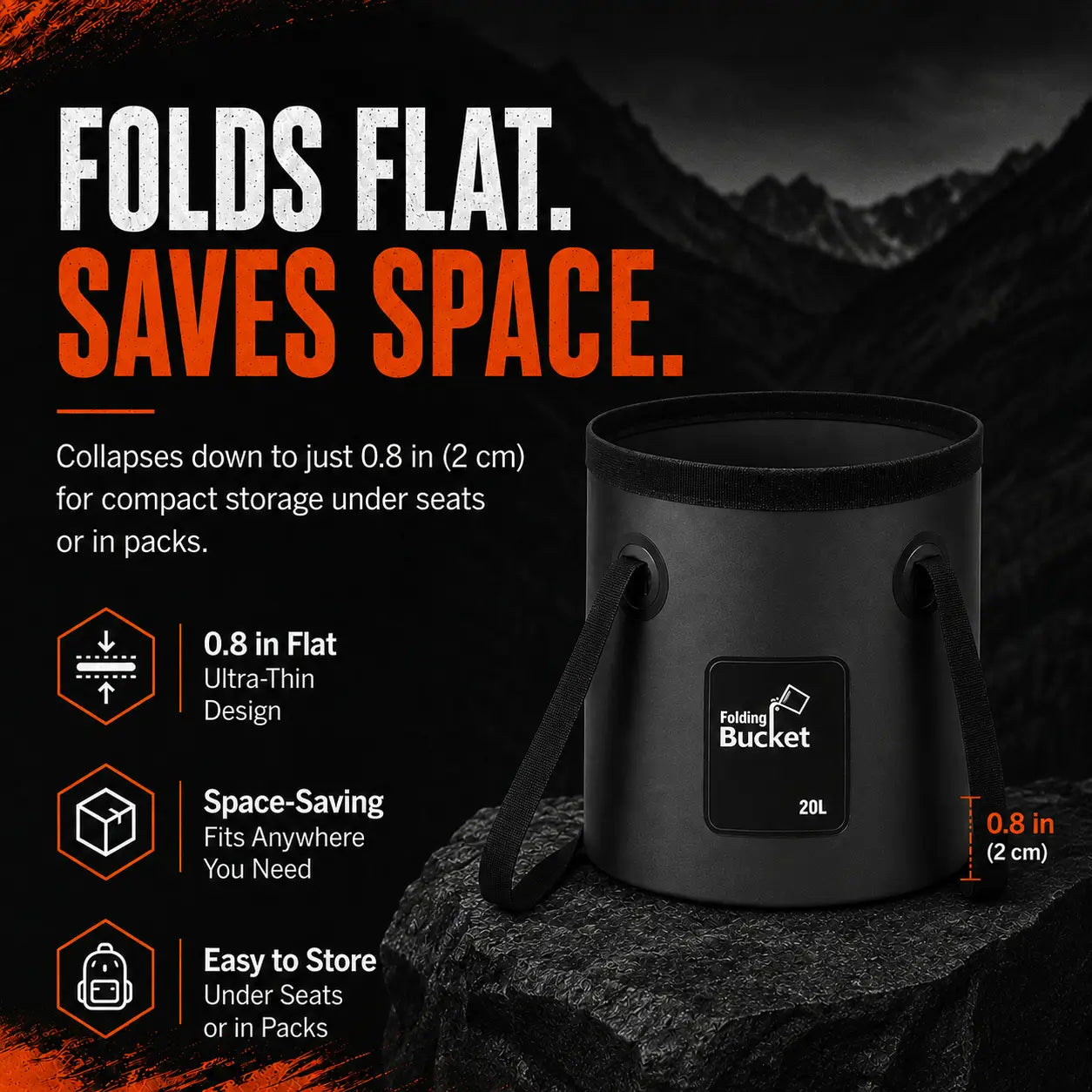 A black 20L collapsible camping bucket sits on a dark textured rock with dramatic mountains in the background. Large bold distressed white and orange headlines read 'FOLDS FLAT. SAVES SPACE.' A red-orange dimension line on the right marks the ultra-thin 0.8 in (2 cm) collapsed profile. Three orange hexagonal icons cleanly showcase its compact storage features: '0.8 in Flat Ultra-Thin Design', 'Space-Saving Fits Anywhere You Need', and 'Easy to Store Under Seats or in Packs', demonstrating its ultimate porta